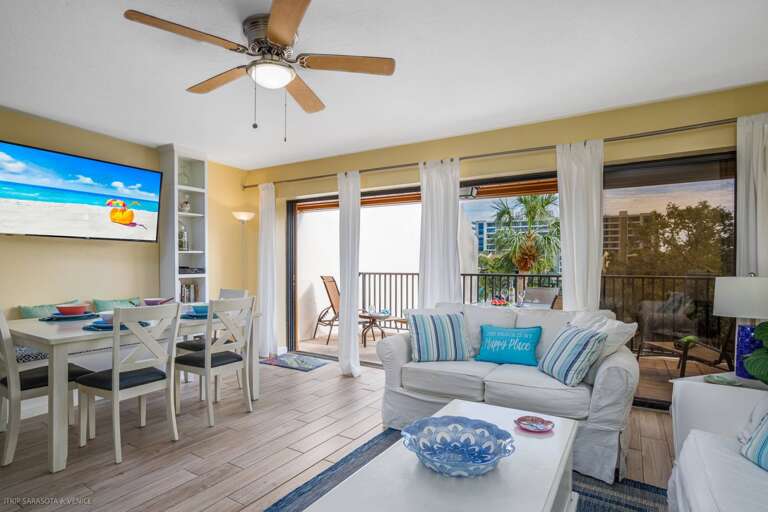 Your bright, beachy living space flows seamlessly to your private balcony, where tropical breezes and peaceful views await.