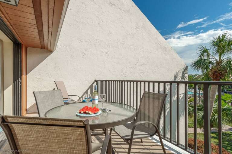 Sip morning coffee on your private balcony while tropical palms sway below and blue skies stretch endlessly above.