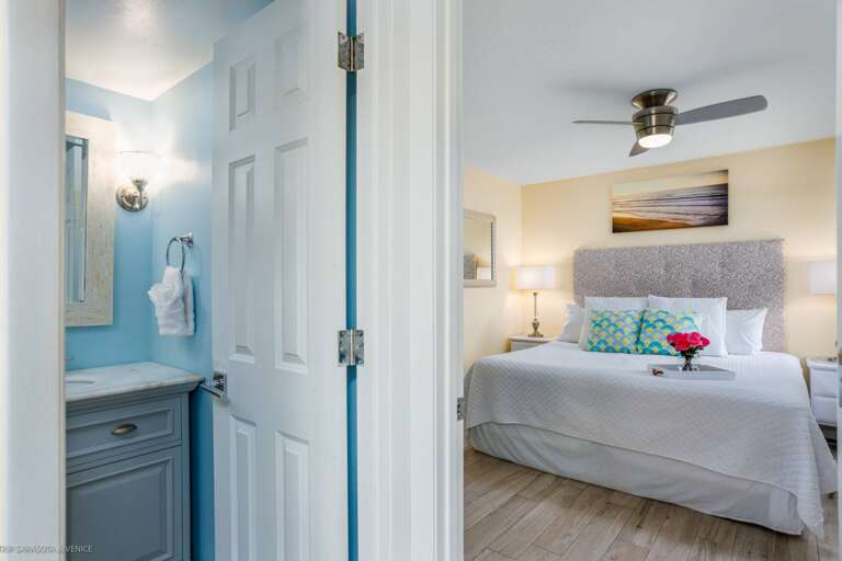 Unwind in your serene bedroom with crisp linens and coastal touches, plus your own private bathroom just steps away.