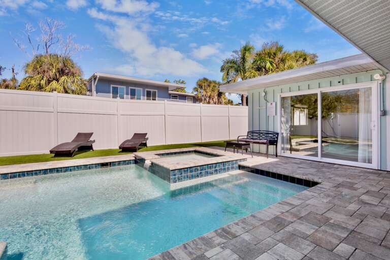 Private Pool, Spa, and Lounge with lush landscaping