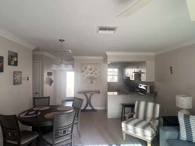 Your open-concept space seamlessly blends kitchen, dining, and living areas with modern finishes and thoughtful dÃ©cor for comfortable gathering.