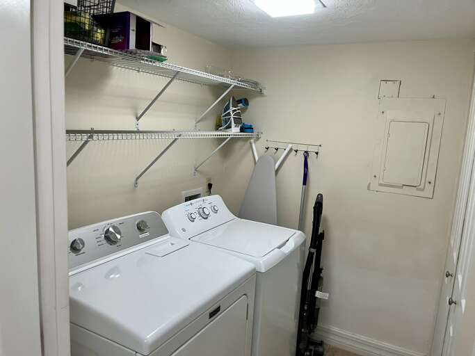 Your private laundry room keeps your stay hassle-free with full-size washer and dryer plus storage shelves for all your needs.