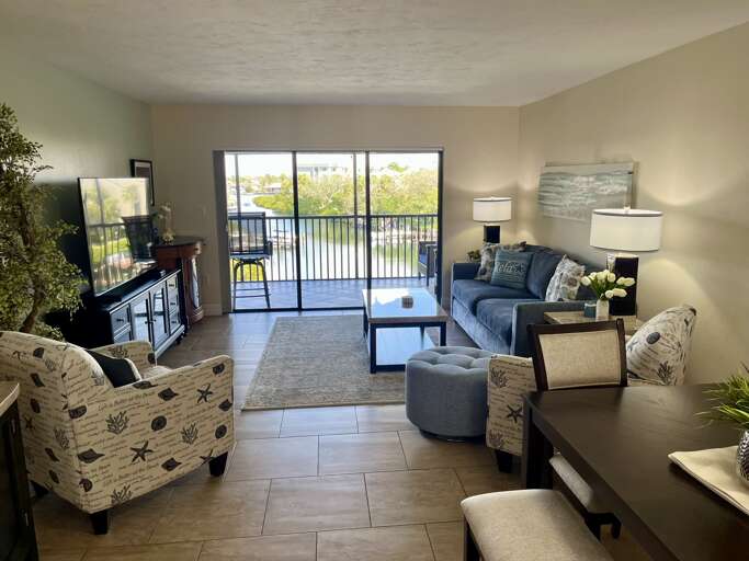 Relax in your stylish living space with comfortable seating and private balcony where you can unwind while taking in peaceful views.