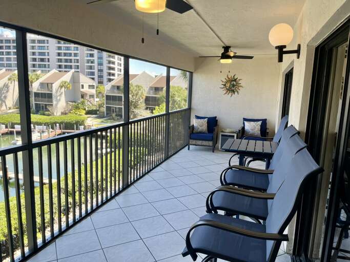 Unwind on your private screened balcony with plush seating and waterfront viewsâperfect for morning coffee or sunset cocktails.