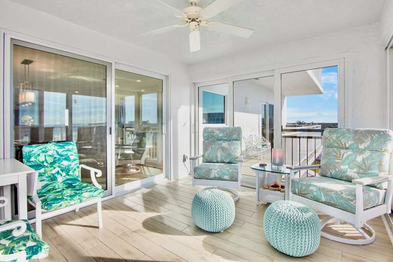 Relax in your tropical oasis with ocean-inspired seating and panoramic views stretching beyond.