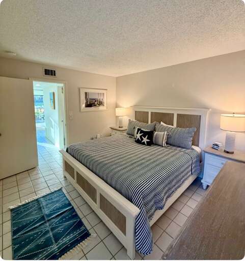 Sleep peacefully in your coastal bedroom with nautical touches and warm bedside lighting creating the perfect seaside retreat.