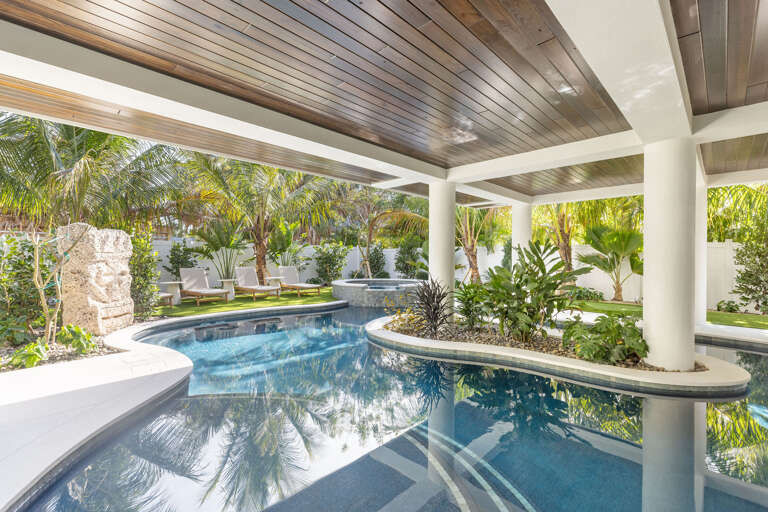 Private pool oasis surrounded by lush tropical palms