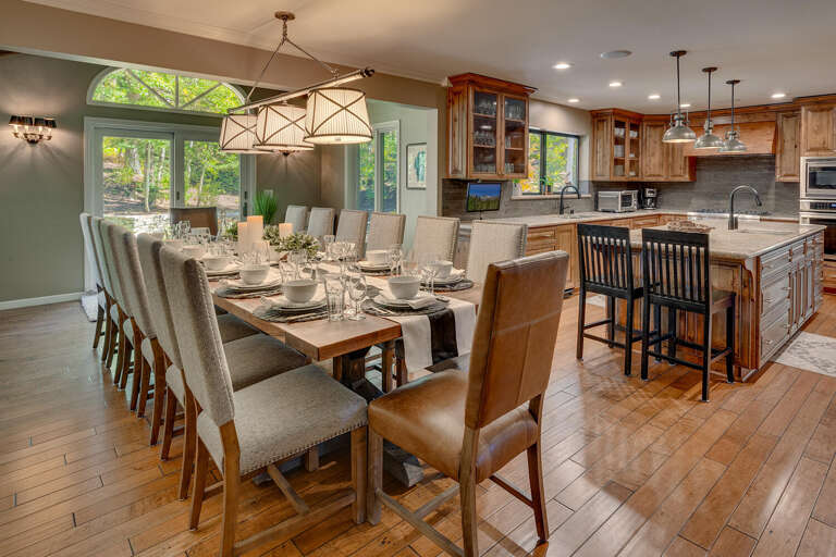 Spacious Dining Area Connected To Kitchen In Vacation Rental, Set For Large Gathering