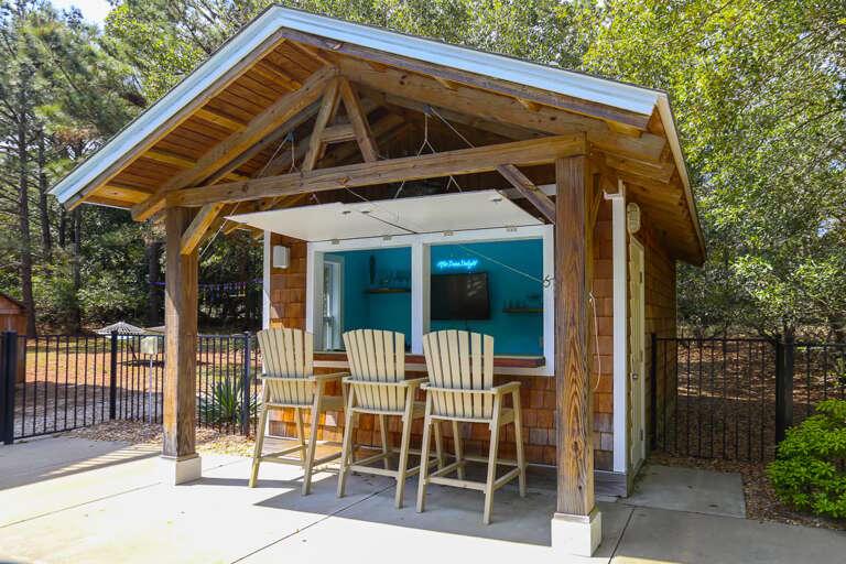 Tiki Bar with Flat Screen Television and Refrigerator 2025