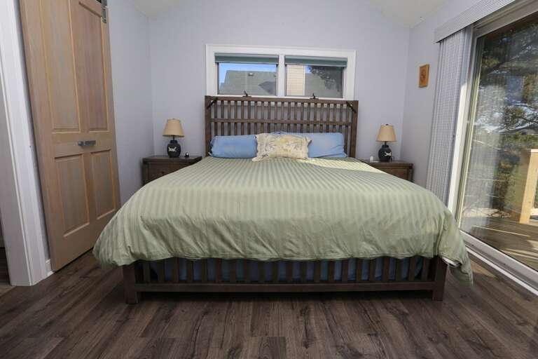 Bedroom 1 2023 - Level 3 - King with private bath and sliding doors to deck