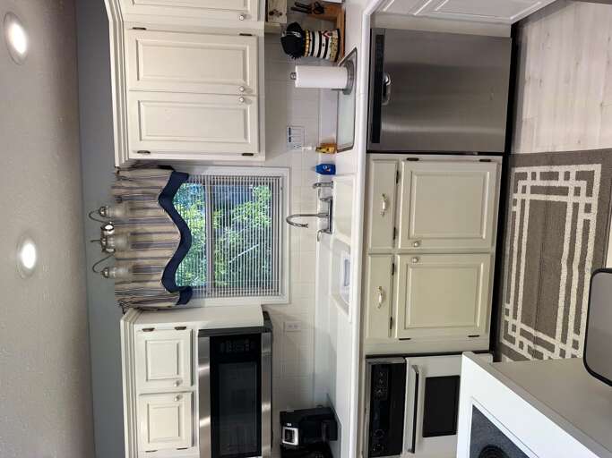 Kitchen  stove top , oven ,coffee pot , micorwave, plenty of dishes and new pots and pans .Two could eat at breakfast bar .