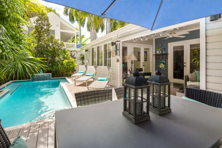 Private pool with lounge chairs and additional seating