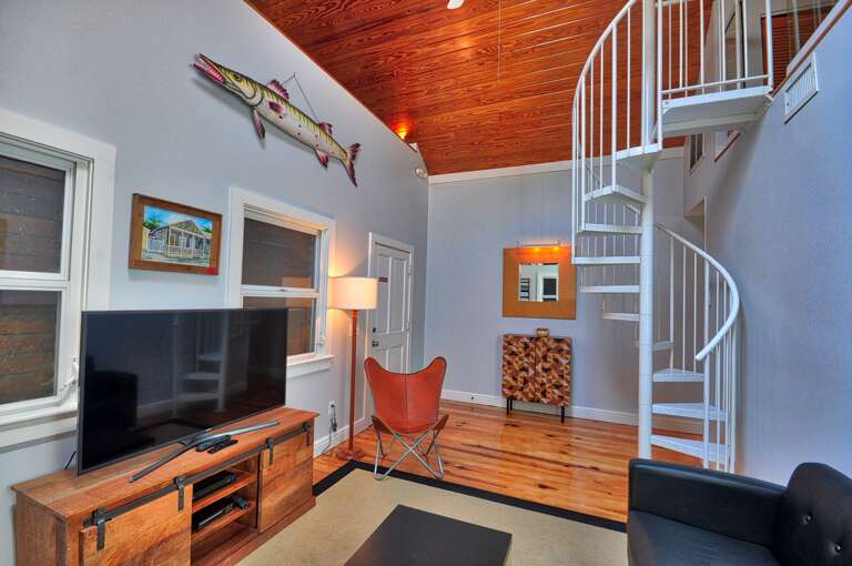 Living Room with Spiral Staircase to Loft Pete's West Cottage Key West Living Room with Spiral Staircase to Loft Pete's West Cottage Key West
