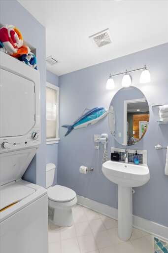 Full bathroom with washer and dryer Full bathroom with washer and dryer
