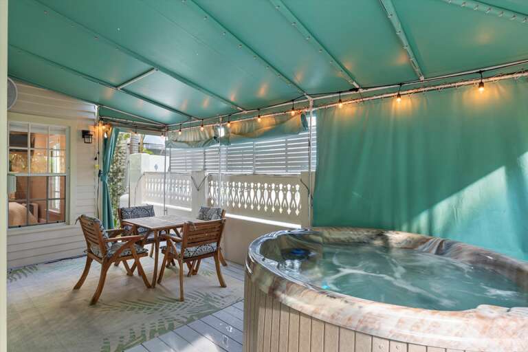 Private hot tub on wrap around porch and outdoor seating Private hot tub on wrap around porch and outdoor seating