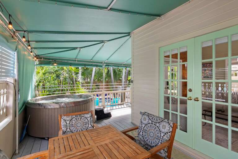 Private hot tub on wrap around porch and outdoor seating / 2nd french door entry Private hot tub on wrap around porch and outdoor seating / 2nd french door entry
