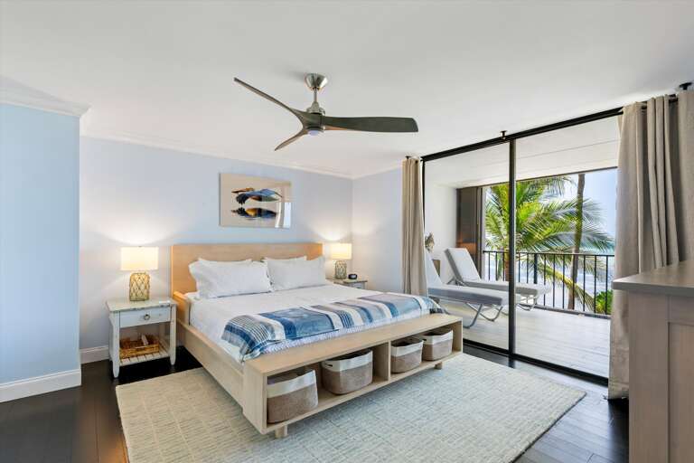 Primary bedroom with walk out balcony and seating