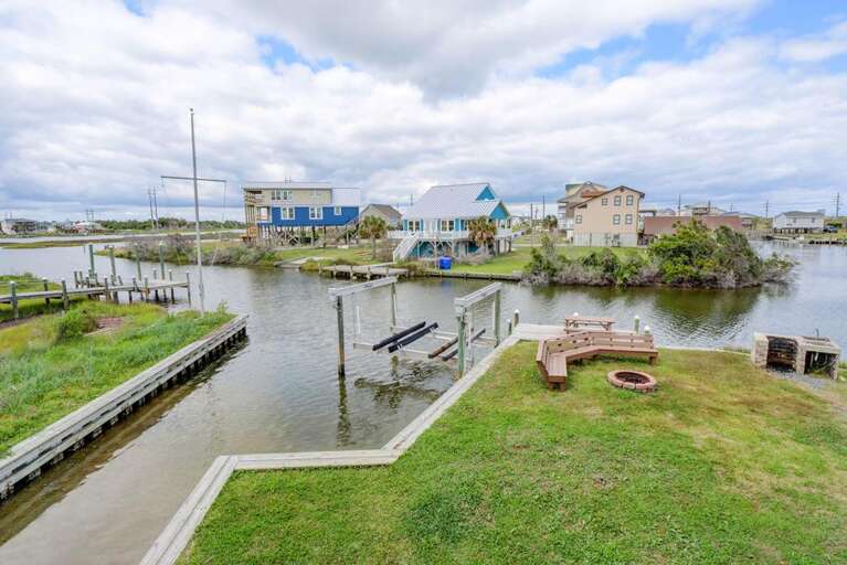Back Yard View of Canal, Ramp and Dock Area