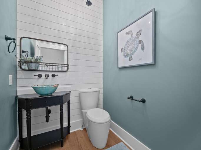 Half Bath off Living Room and Kitchen