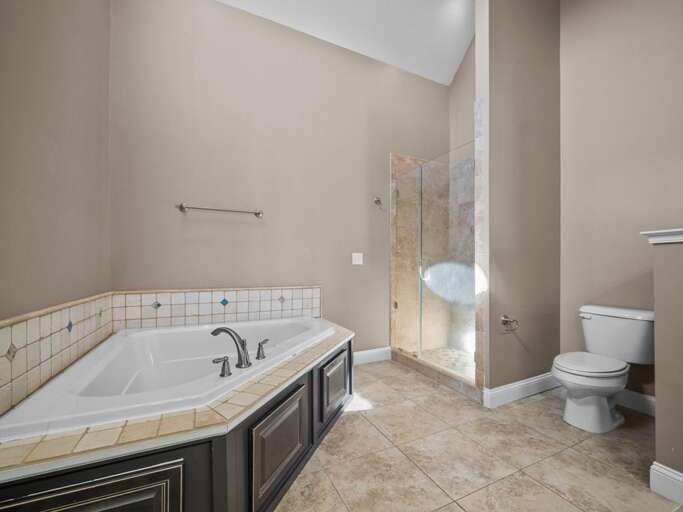 Large Soaking Tub - Glass Tiled Shower