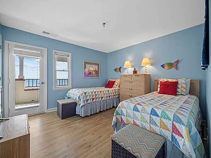 Bedroom 3 has 2 Twin Beds, TV and Balcony Access