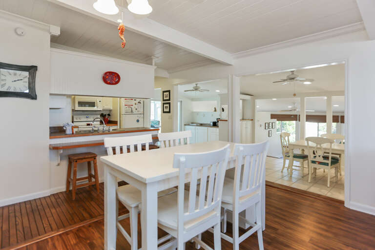 Dining Table with View of Kitchen and Large Dining Area