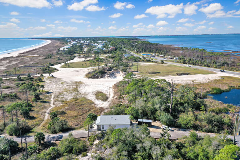 Located on the Beachside Between the Gulf & Bay