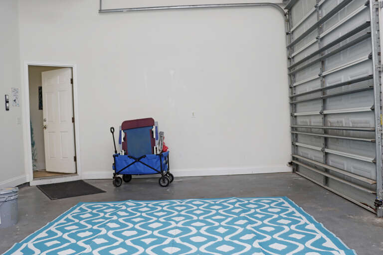 Enclosed Garage With Refridgerator and EV Charger