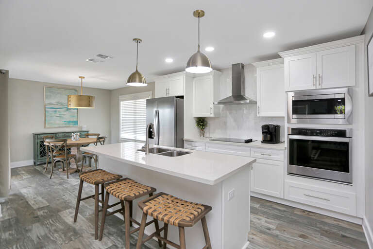 Upstairs Kitchen with Bar Seating & Dining Area