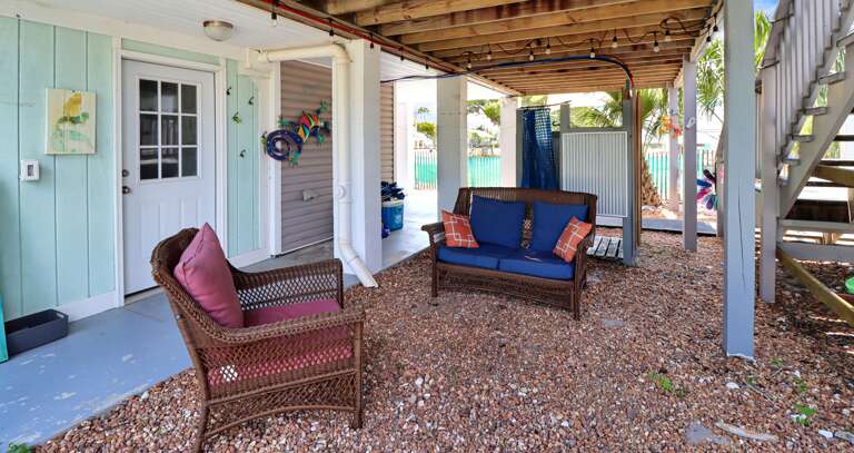 Sitting Area Under House with Outdoor Shower