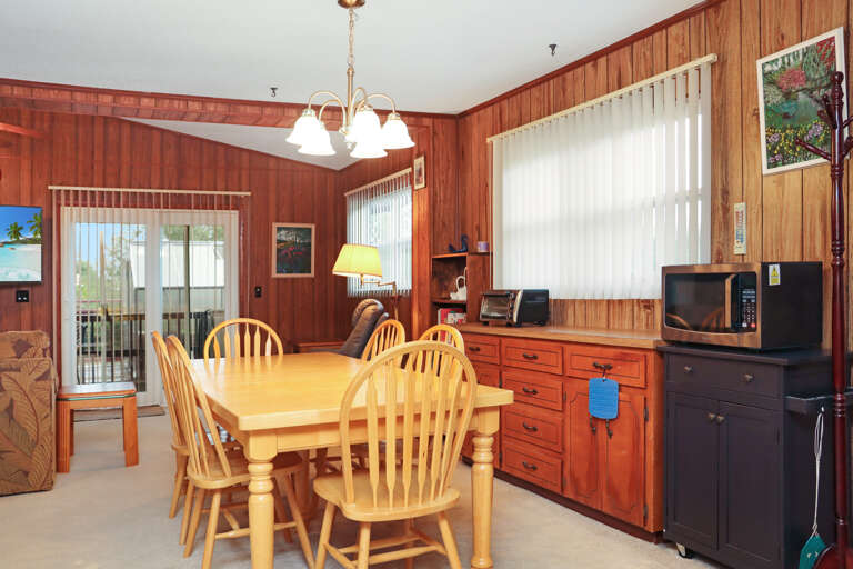 Upstairs Dining Area with View onto Screened Deck