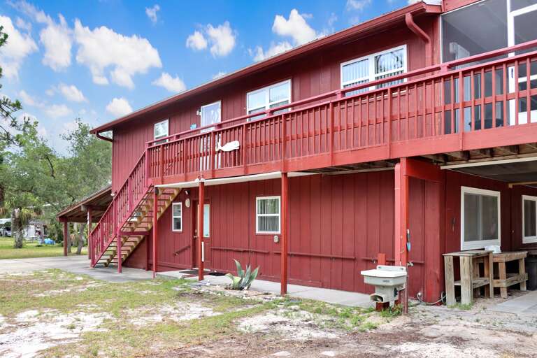 Side Exterior with Main Entrance Upstairs and Down
