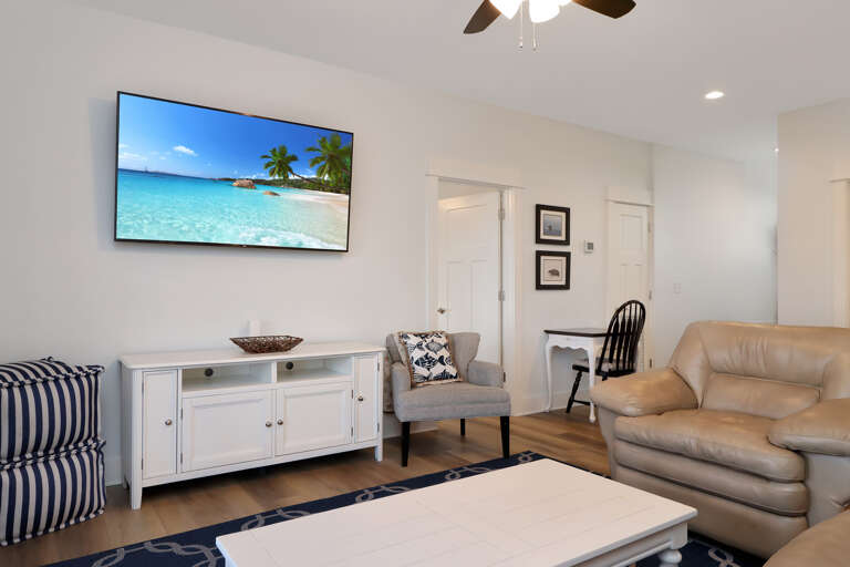 2nd Floor Living Area with TV and Small Deck