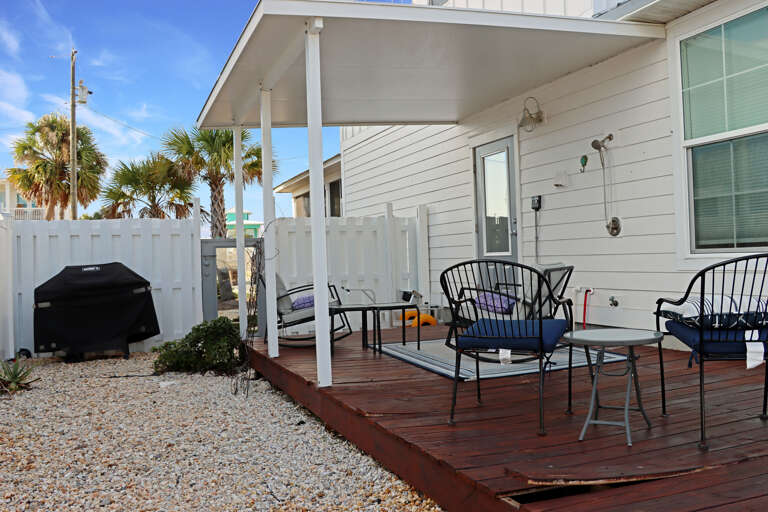 Outdoor Sitting Area with Gas Grill and Outdoor Shower