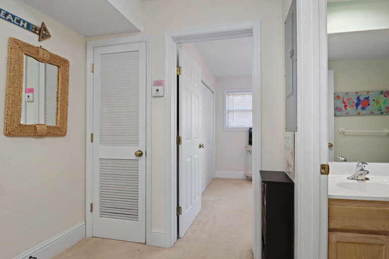 Main Floor Hallway with Full Bath and Bedroom 1