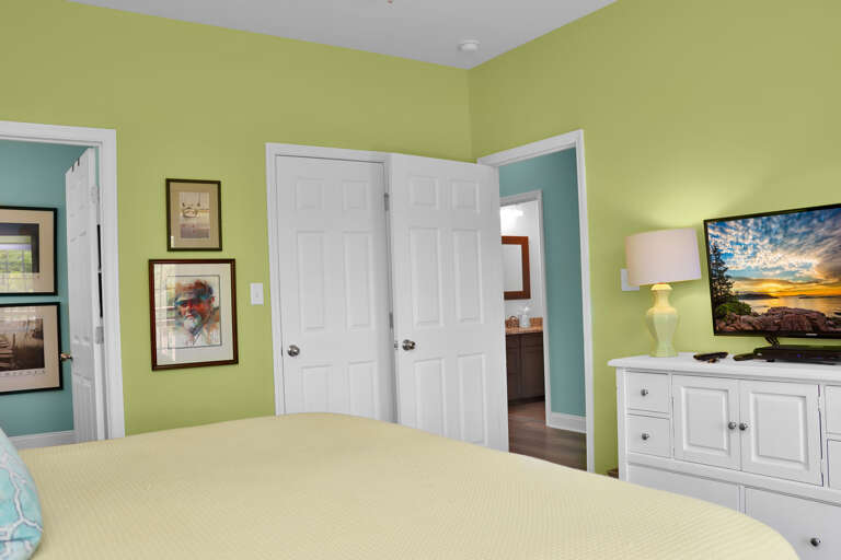 Bedroom 1 with TV and Master Bath