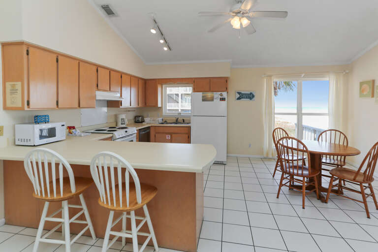Kitchen with Bar Seating & Dining Area