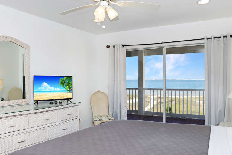 Bedroom 1 with TV and Deck Access