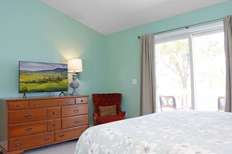 Master Bedroom 1 with TV and Deck