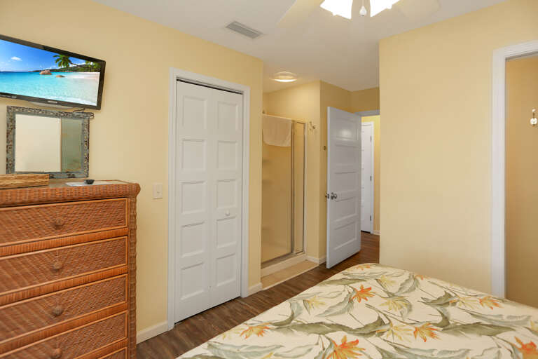 Bedroom 1 with TV & Shower in Room