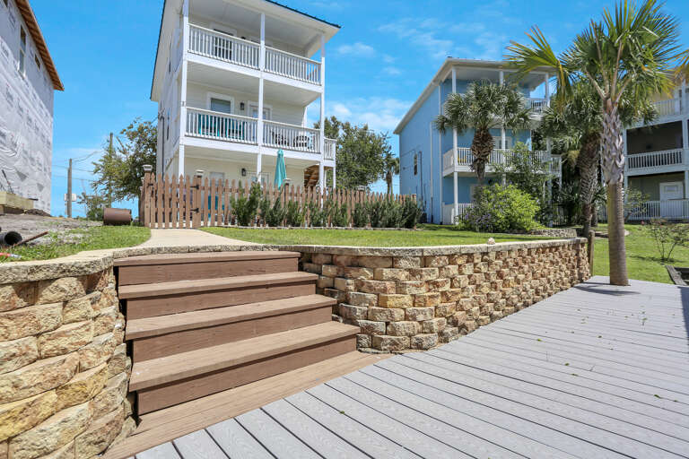 Nicely Manicured Lawn with Deck Steps