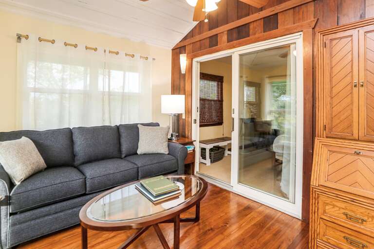 Sleeper Sofa in Sitting Area with Access to Bedroom