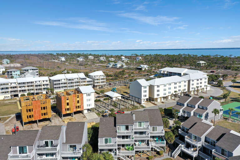 Building Close to Tennis with Bay in Background