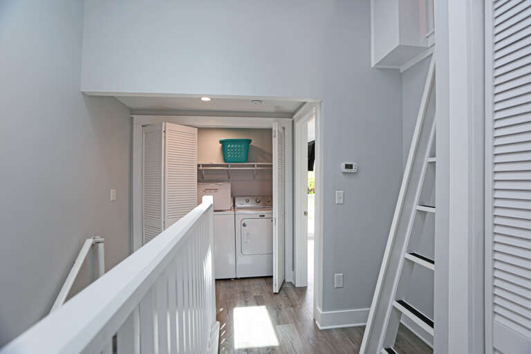 Upstairs Hallway with Laundry Closet and Ladder to Loft Upstairs Hallway with Laundry Closet and Ladder to Loft