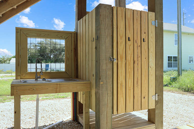 Under House with Outdoor Shower and Fish Cleaning Area