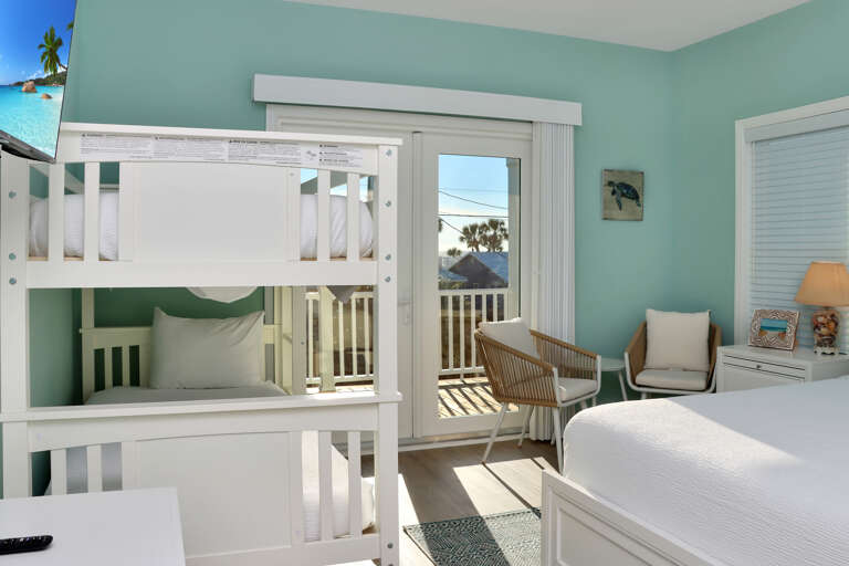 Bedroom 3 with Bunk Beds, TV and Beach View Deck