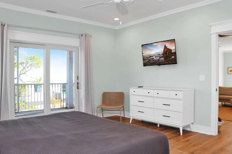 Bedroom 1 with TV and Screened Deck