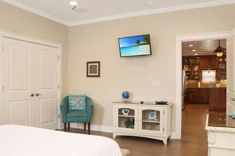 Bedroom 1 - TV and View into Kitchen