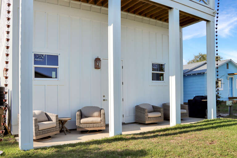 Covered Porch Overlooking Backyard