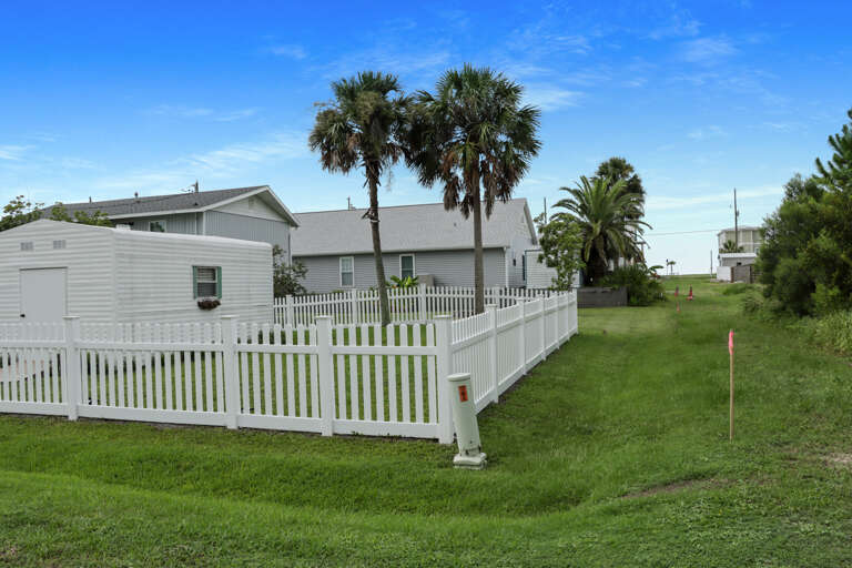 View Towards the Beach Behind Backyard Fence